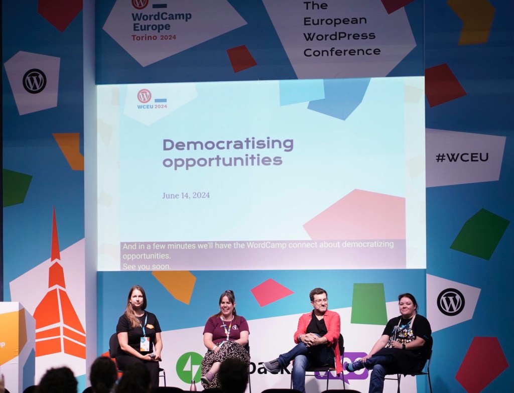 Four panellists seated on stage during the Connect Series at WCEU. Photo by Fede Padilla.